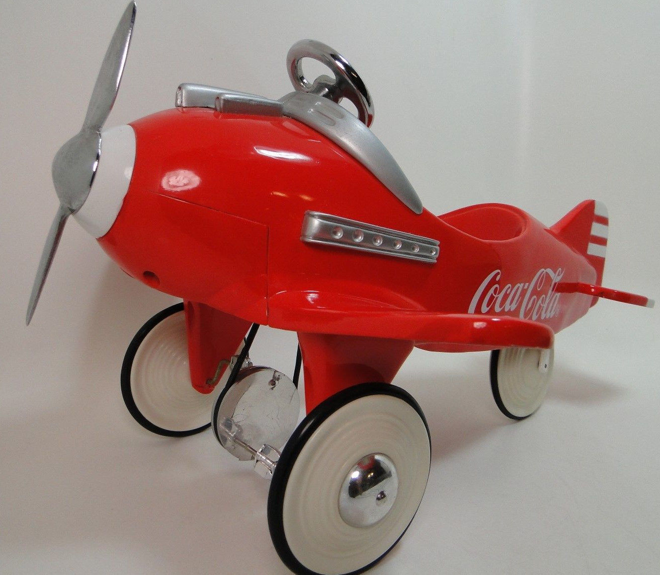 red metal pedal car