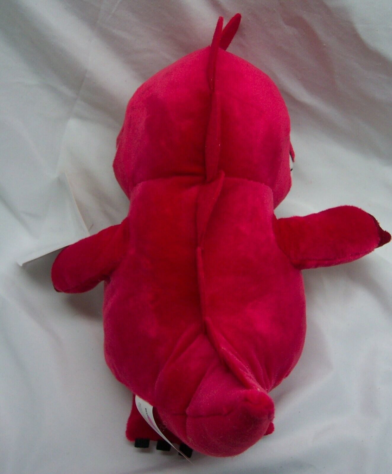 red stuffed dinosaur