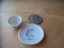 1986 Precious Moments Miniature “April” Teacup and Plate  - $0.00