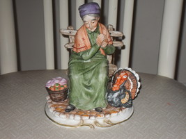 Vintage Lefton Woman Sitting On Bench With A Turkey Porcelain Figurine - $44.99