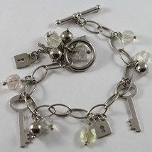 .925 RHODIUM SILVER BRACELET WITH QUARTZ CITRINE AND CHARMS OF KEYS AND ... - $96.00