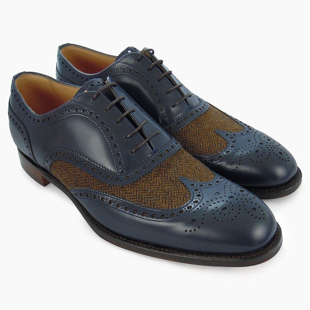 brown and blue wingtip shoes