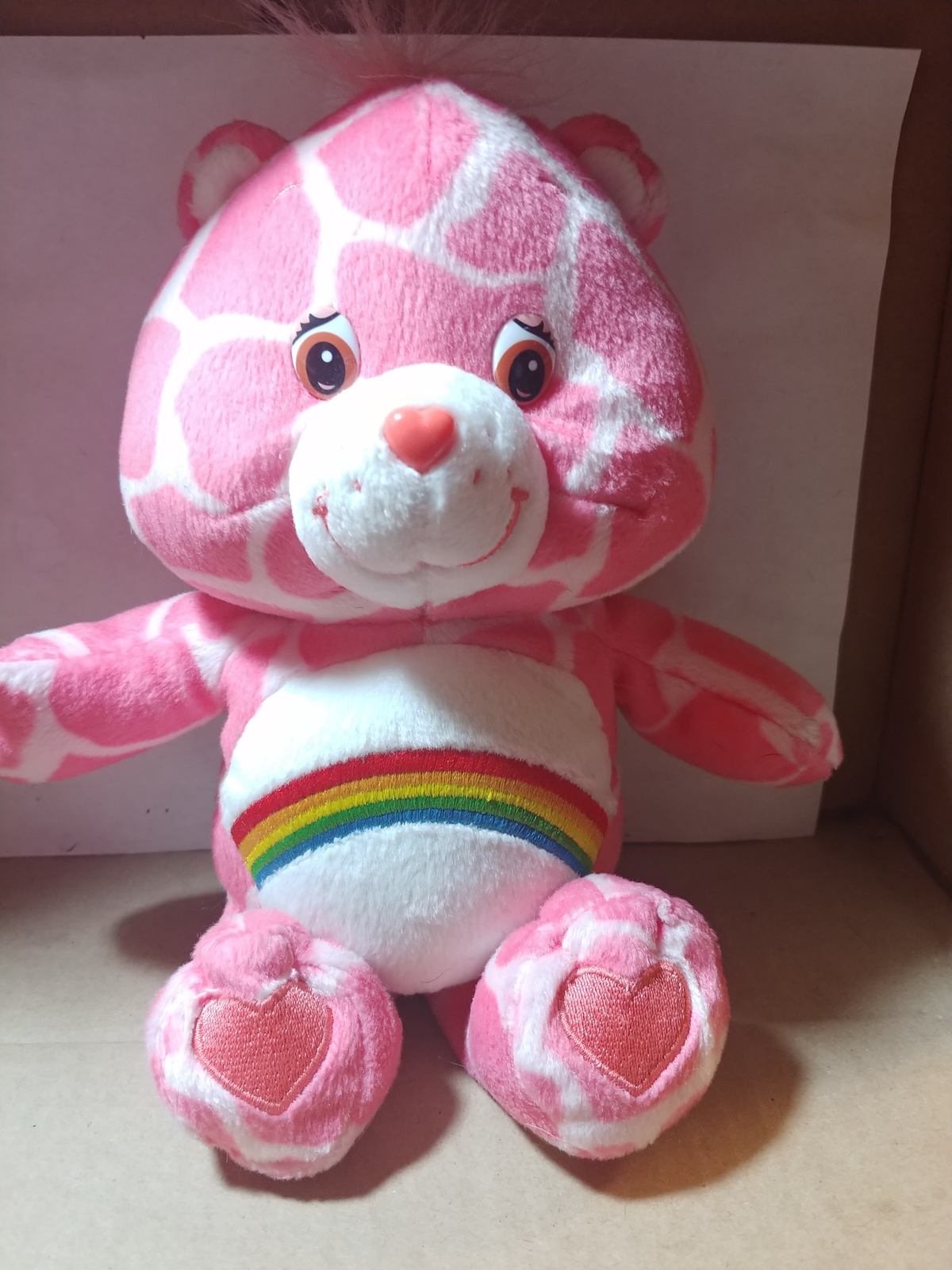 pink care bear with rainbow belly