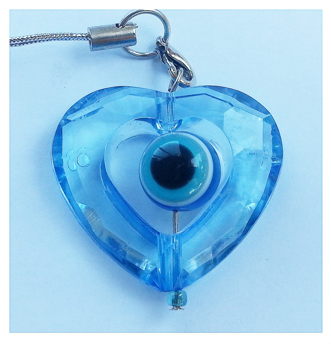 Spinning transparent heart Mobile phone strap evil eye protection from Israel
