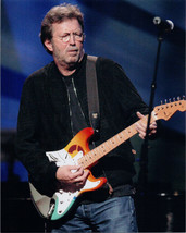 Eric Clapton 8x10 press photo in black jacket playing guitar on stage 19... - $12.00
