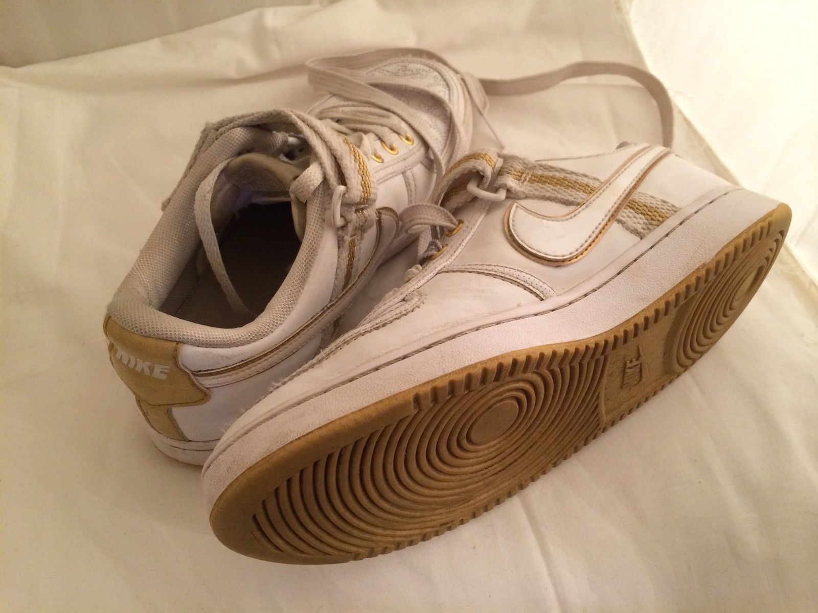 womens white nike shoes with gold swoosh