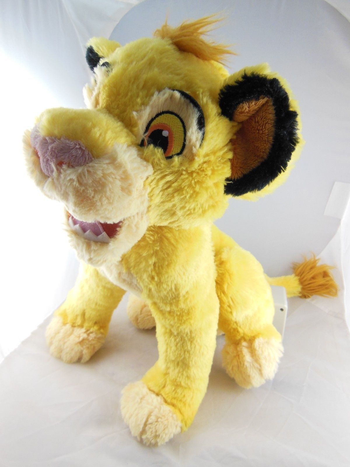 simba plush in pouch