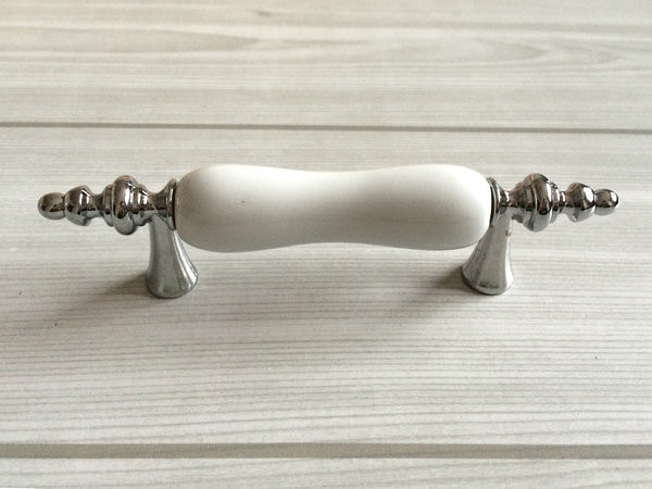 white porcelain drawer pulls        
        <figure class=