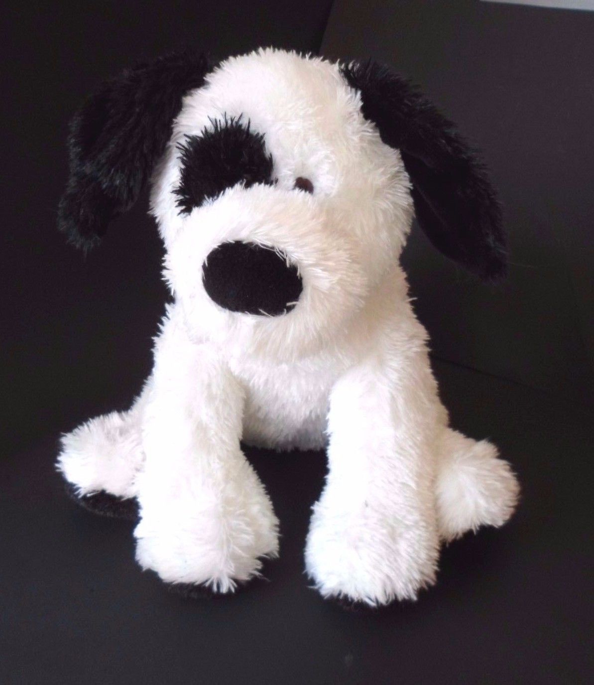 black and white puppy stuffed animal