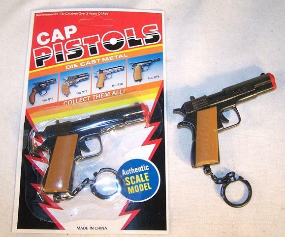 12 CARDED DIECAST 45 MAGNUM KEY CHAIN novelty cap gun toy NEW play ...