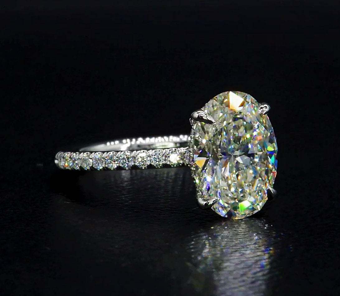 Oval Cut Simulated Diamond Hidden Halo Engagement And
