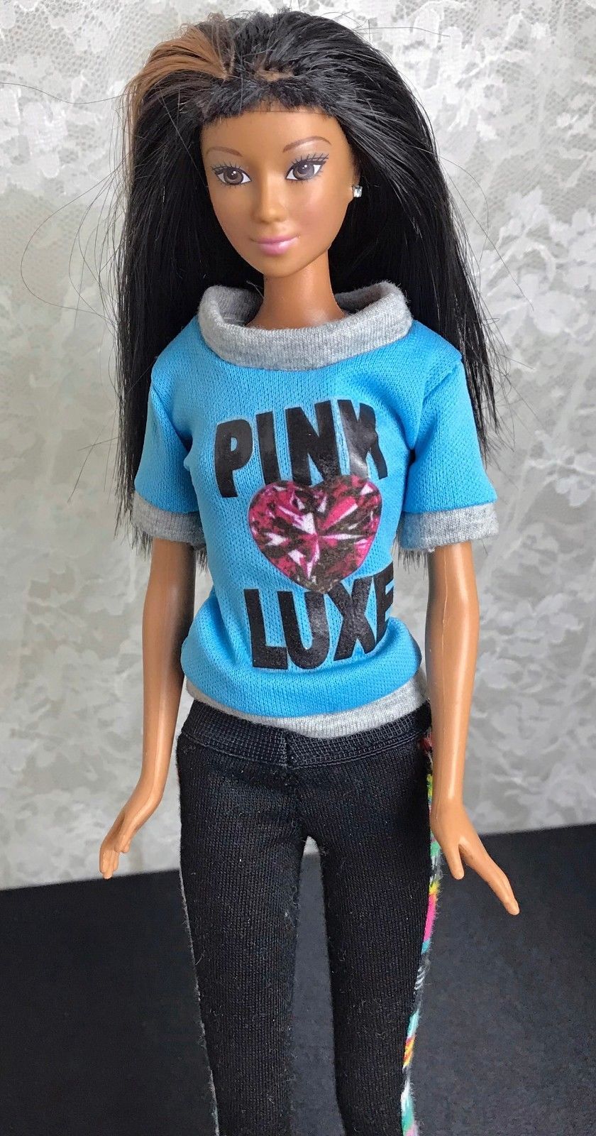 barbie doll with brown hair and brown eyes