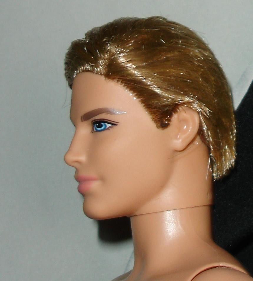 Nude blond Ken doll rooted hair monogrammed underwear and one bent arm left