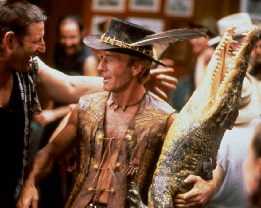 Crocodile Dundee Paul Hogan Holding Stuffed Crocodile in Bar 8x10 Photo