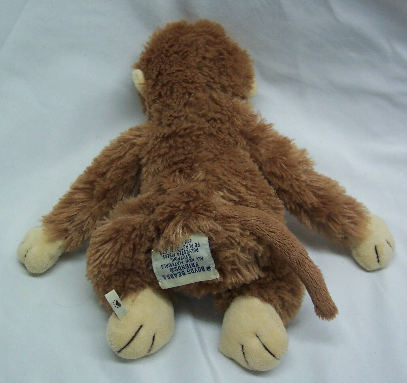 brown stuffed animal with teeth