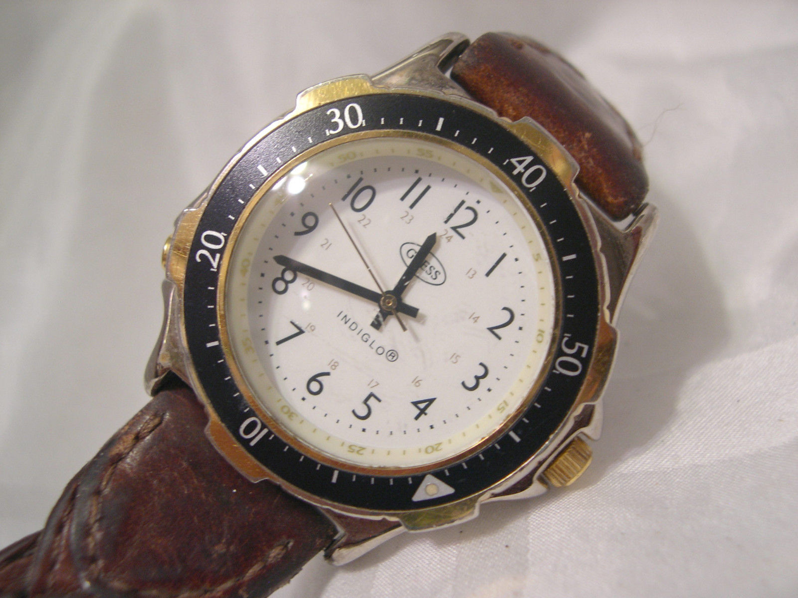 M12, Guess Indiglo, Mens White Faced Watch, 9" Brn. Braided Leather