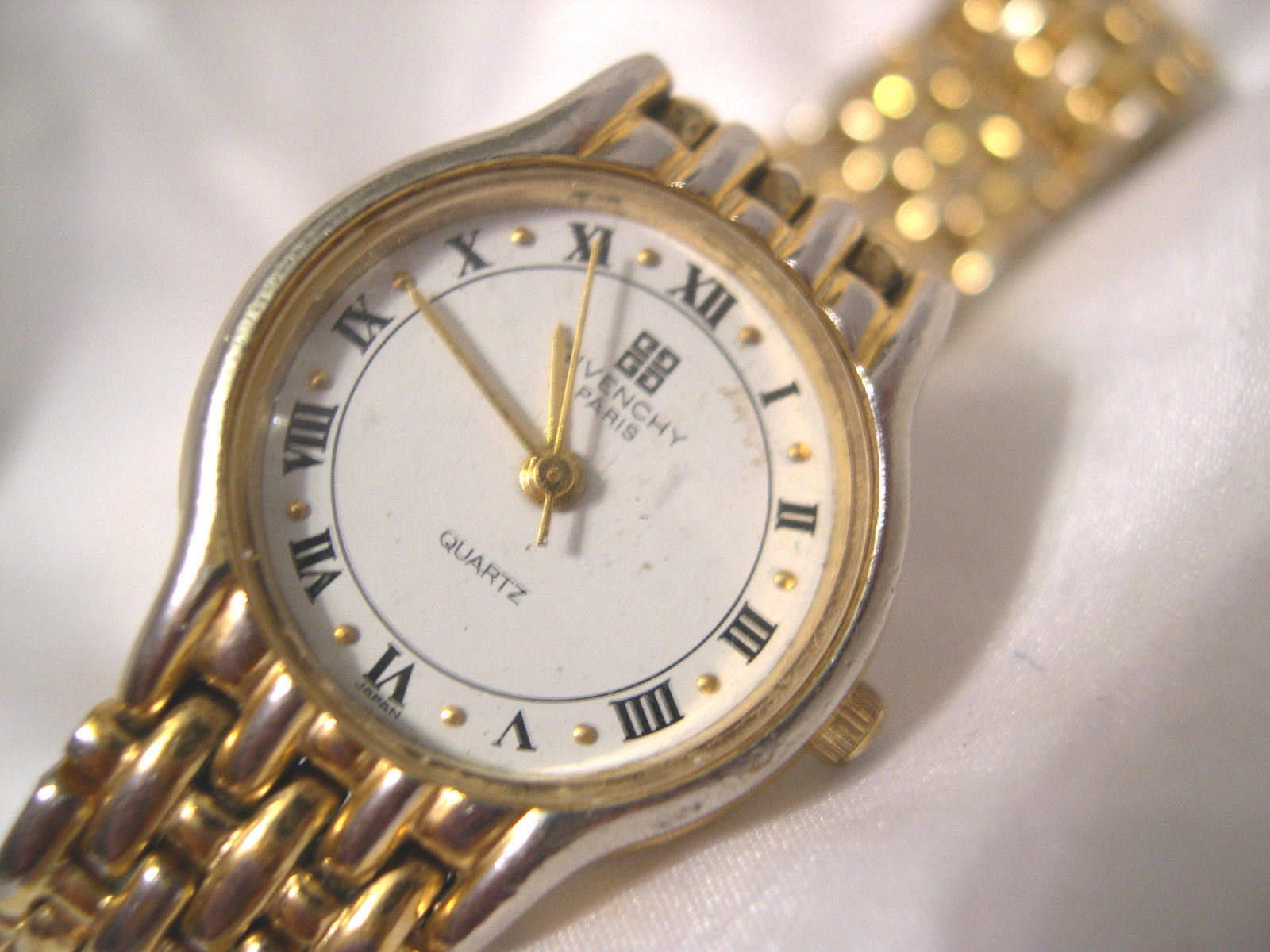 L62, Givenchy Paris, Gold,Tone 6.5" Link Band, White Face, D.A.L.90