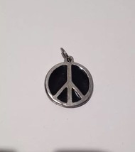 black and silver toned peace sign pendant - $48.99