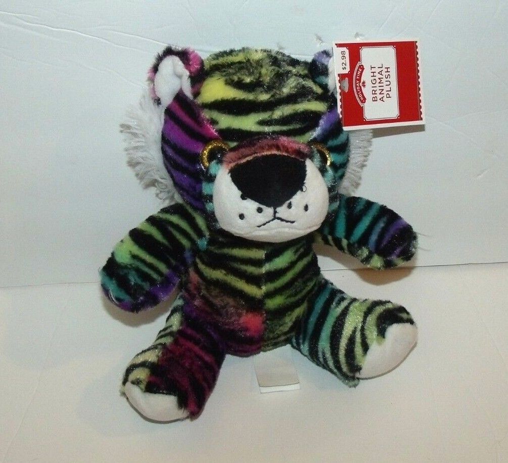 cat and stuffed tiger