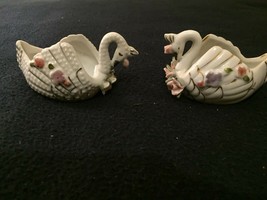 Pair of decorative porcelain swans each with cavity to hold whatever you... - $4.50