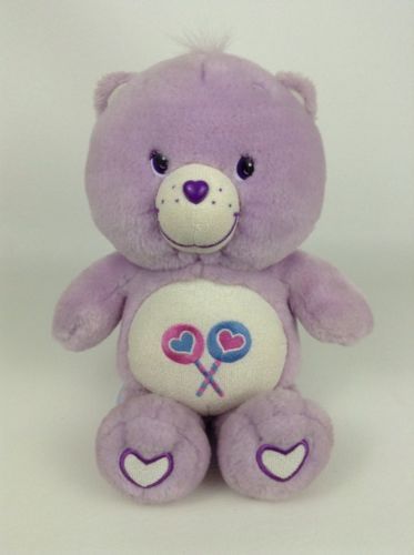 purple care bear with 2 lollipops