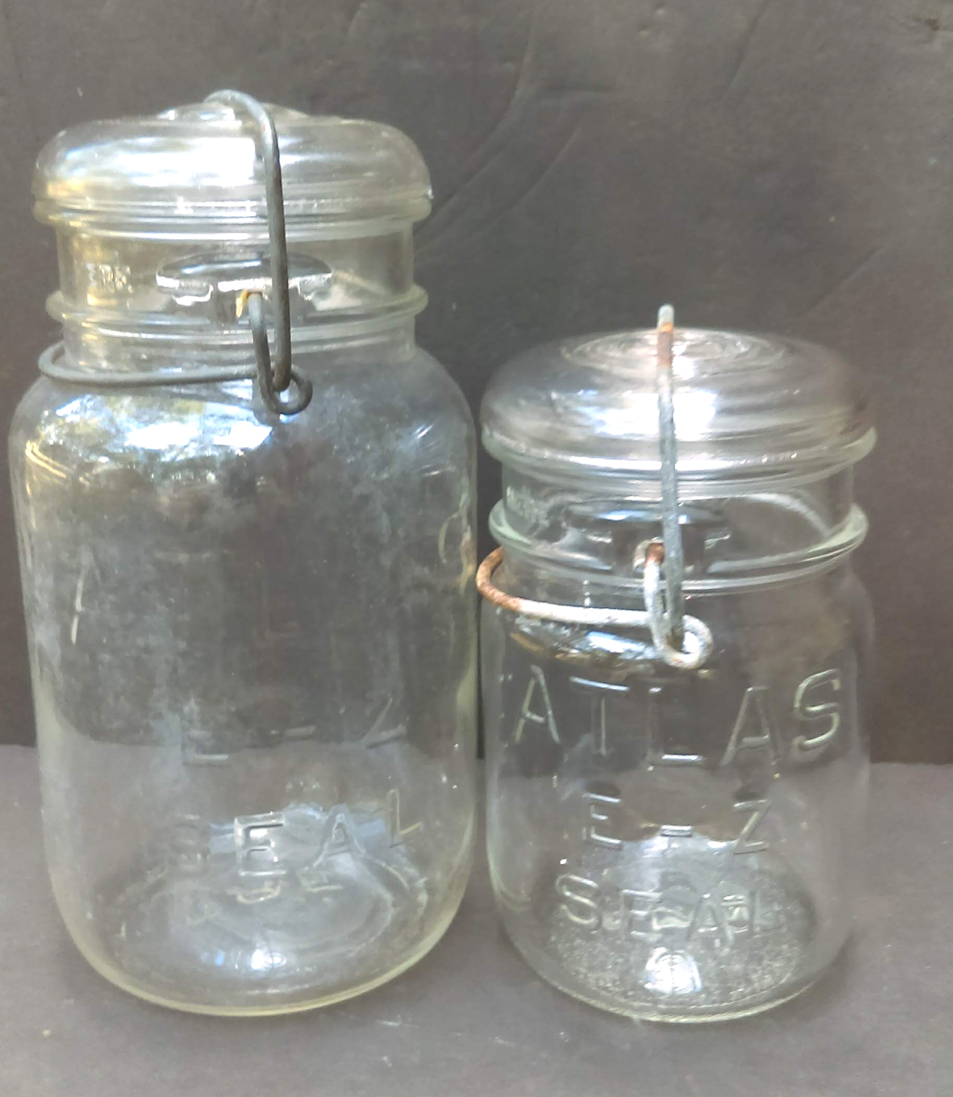 quart and pint Vintage pair of Atlas canning jars with glass lids E Z seal