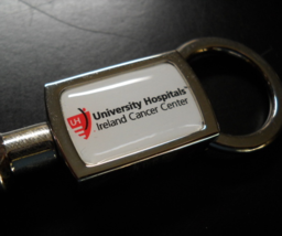 University Hospitals Ireland Cancer Center Key Chain Plunger Release Metal - $7.99