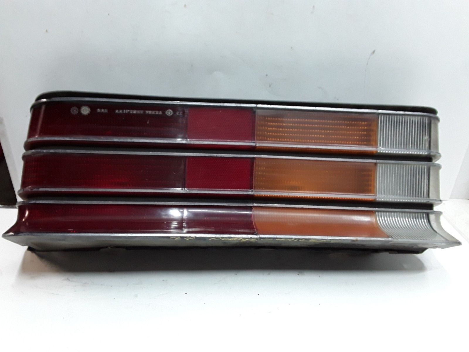 79 80 Dodge Omni 2door left driver side tail light with chrome accents OEM Tail Lights