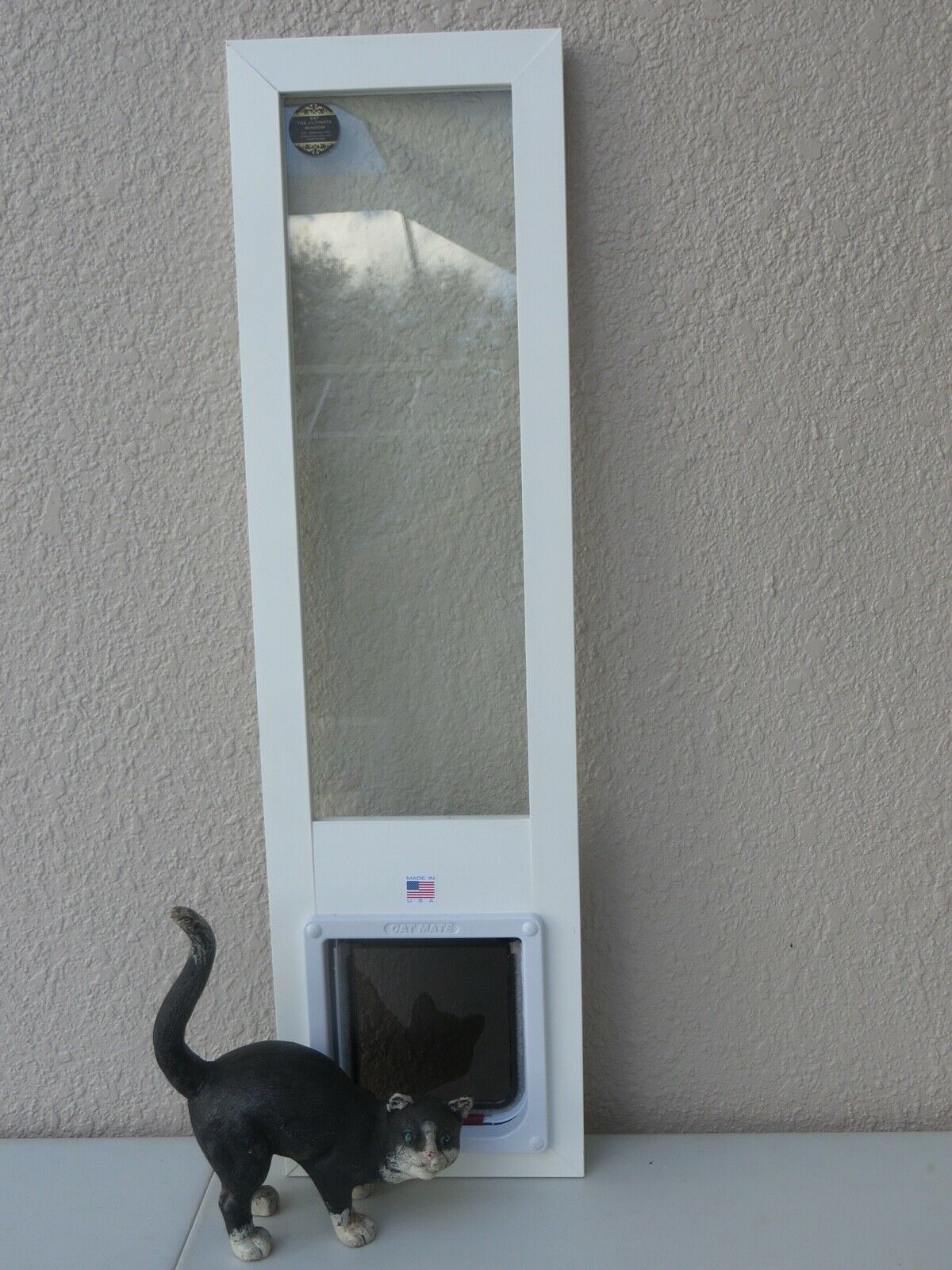CAT door, sash window insert. vinyl with shims, 1622 high, 7x11 flap