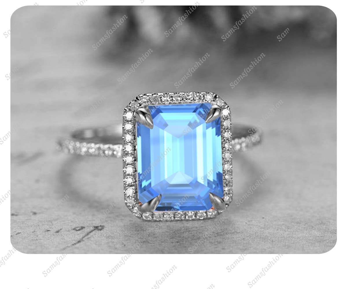 8x10mm Emerald Cut Blue Topaz 14k White Gold Over .925 Silver Anniversary Ring