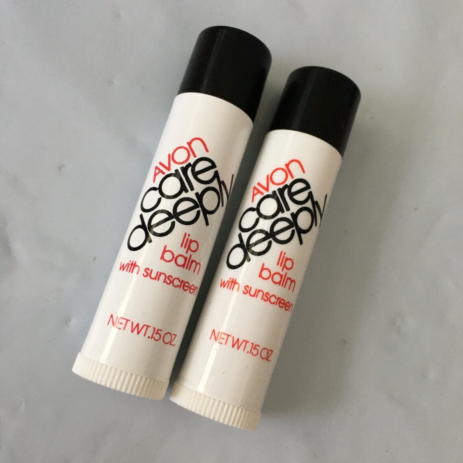 NOS 1982 Lot of 2 Avon Care Deeply with Sunscreen Lip Balm .15 oz Movie
