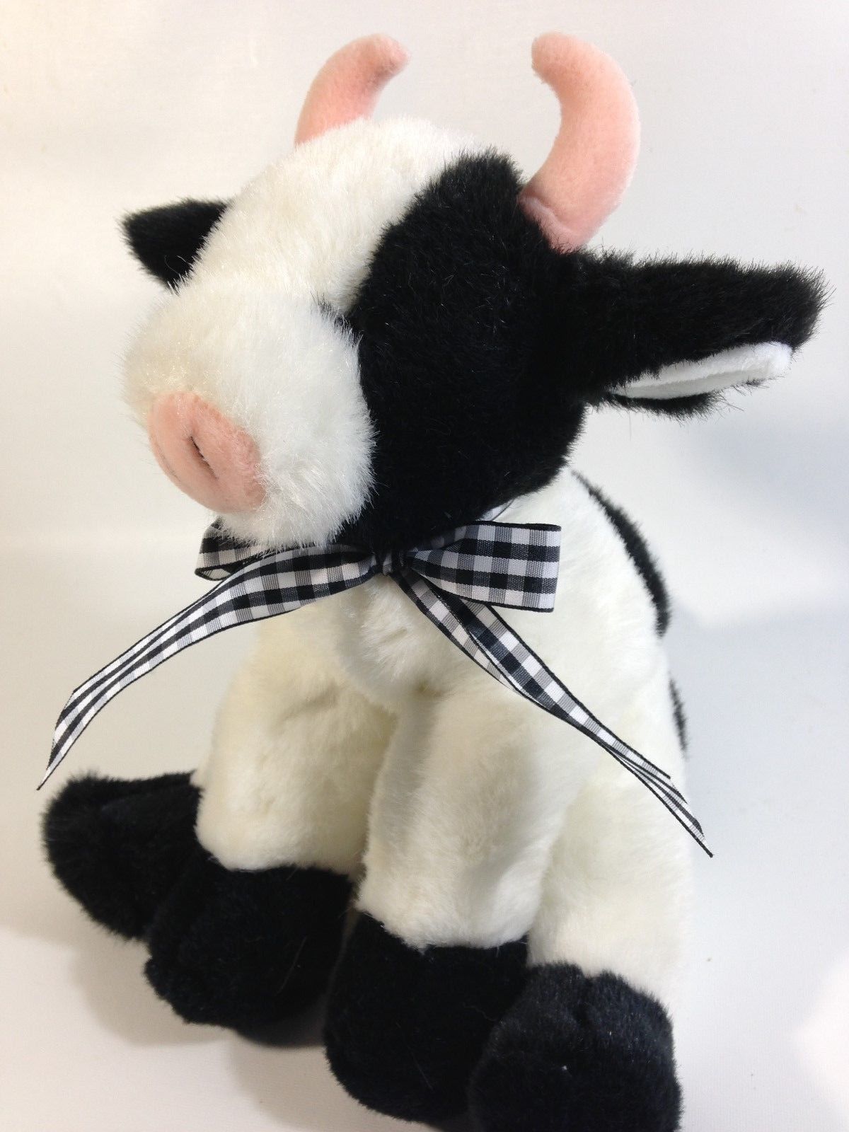 black and white stuffed cow