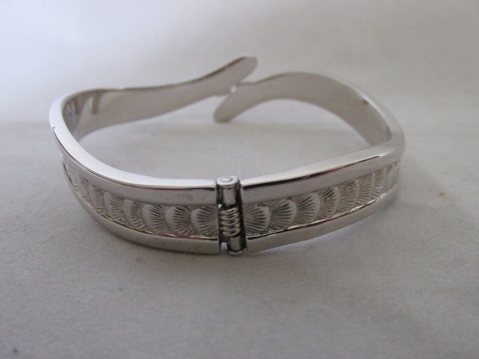 Silver Toned Hinged Cuff Bracelet with Seashell Design Bracelets
