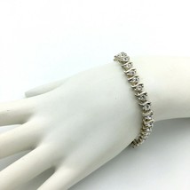 BMNY silvertone Swarovski crystal tennis bracelet - fold-over clasp eleg... - $19.60