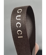 GUCCI RIBBON BROWN WITH METALLIC LETTERS SOLD BY YARD  - $18.00