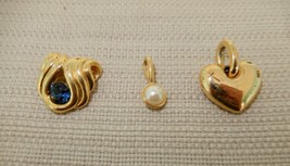 Gorgeous lot of three vintage 1980's Nolan Miller gold tone pendants - $30.00