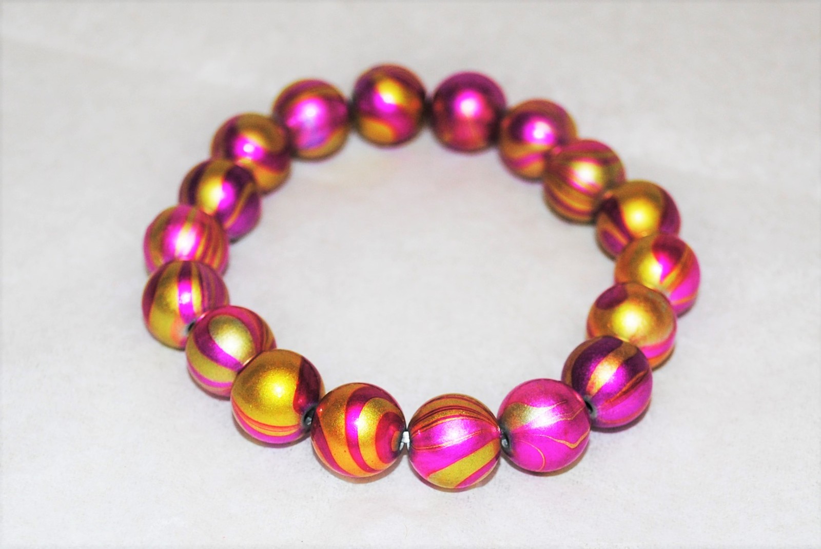 Pink and Gold Acrylic Swirl Bead Stretch Bracelet  - $12.00