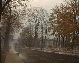 Burning fall leaves in the street of Norwich Connecticut 1940 Photo Print - $8.81+