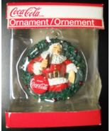 American Greetings Christmas Ornament 2010 Coca Cola Santa Red Disk Wrea... - $10.99