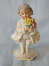 An item in the Pottery & Glass category: Karl Ens Boy Standing With Flowers, small flower chip