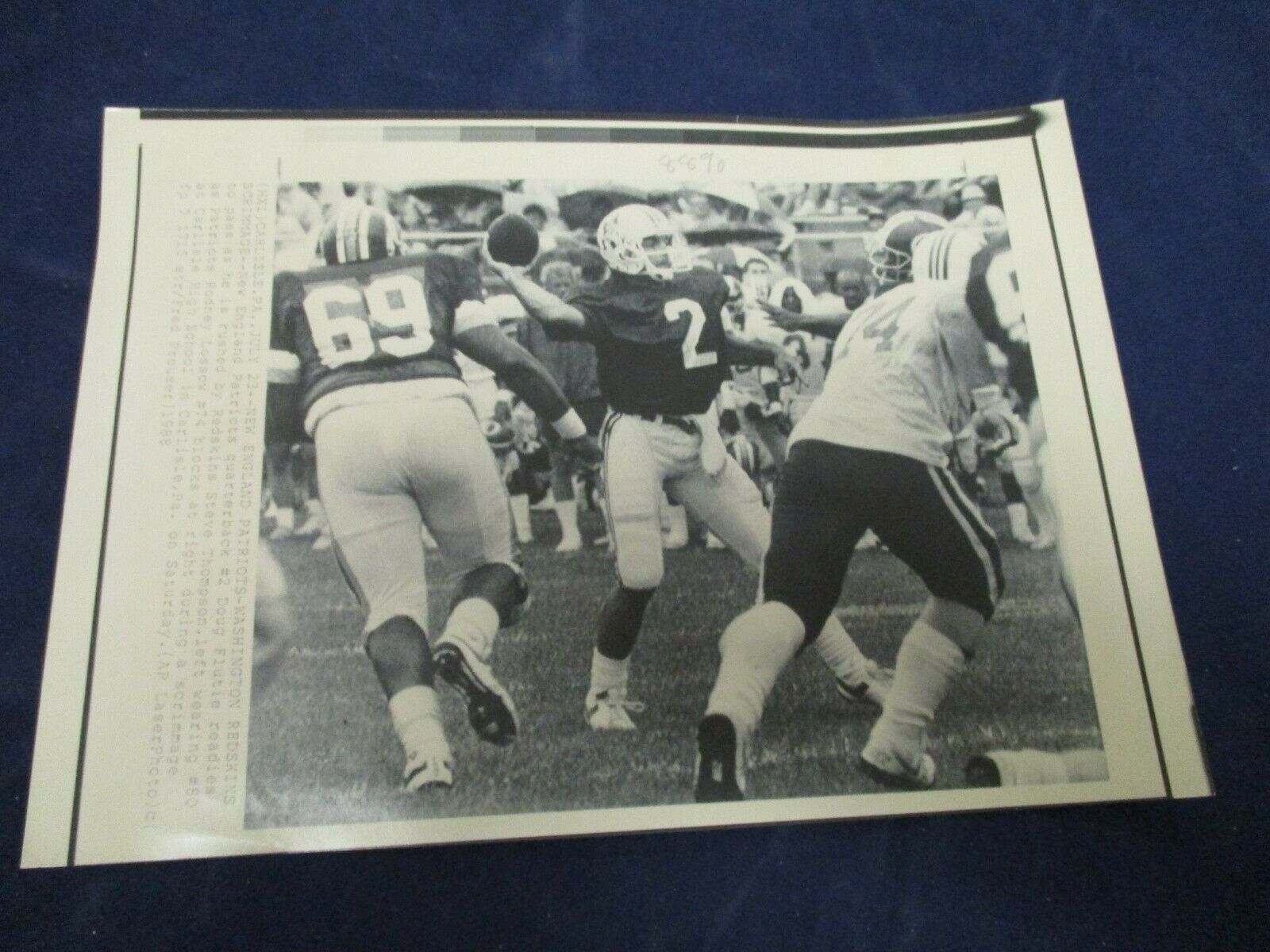 1988 Doug Flutie #2 readies to pass as he's rushed Vintage Wire Press ...