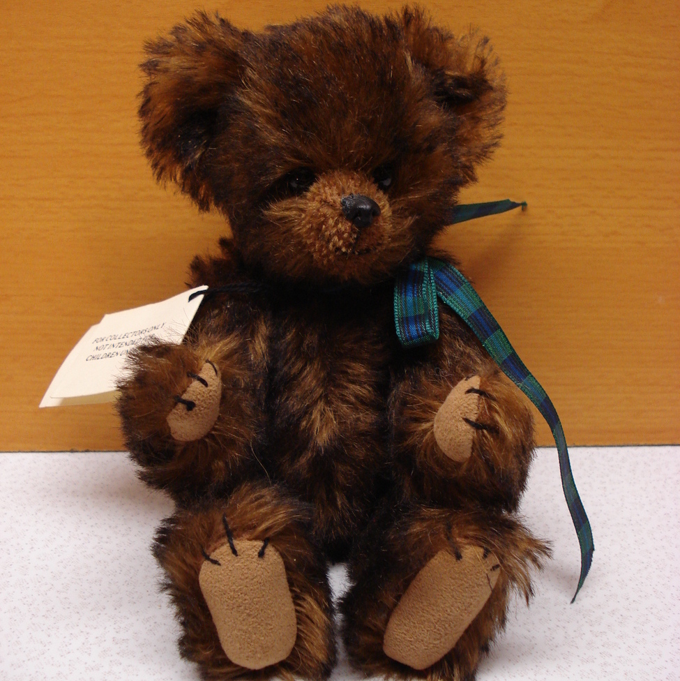 teddy bear with wooden face