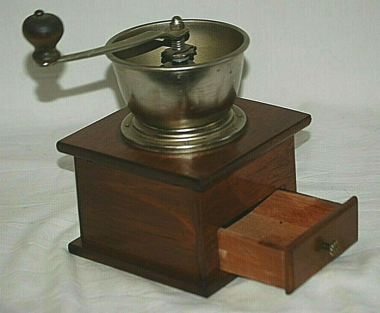 A vintage Peugeot coffee grinder with bakelite lid kitchenware