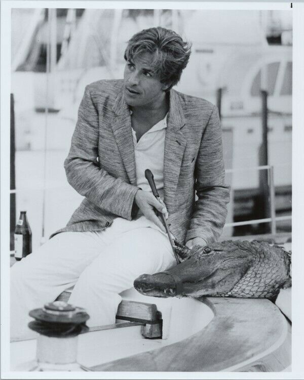 Don Johnson sits on boat next to Elvis the alligator his pet Miami Vice 8x10