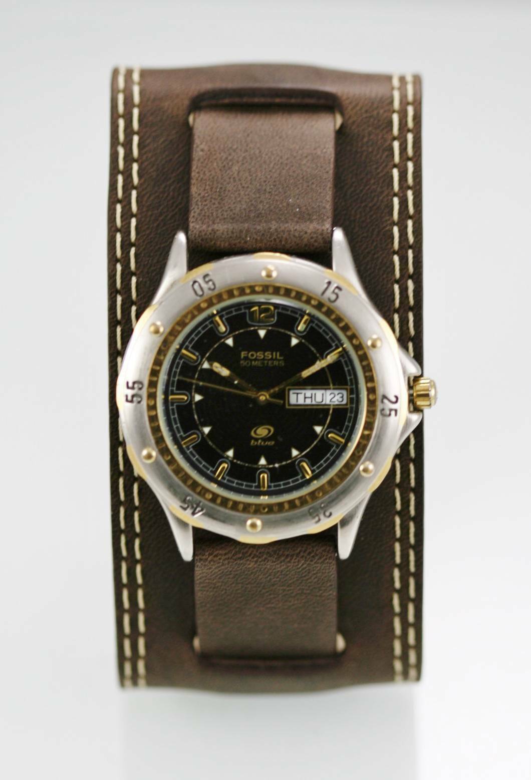 gold and silver fossil watch men's