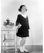 Shirley Temple holding flowers in coat and hat 24x36 inch poster - $29.99