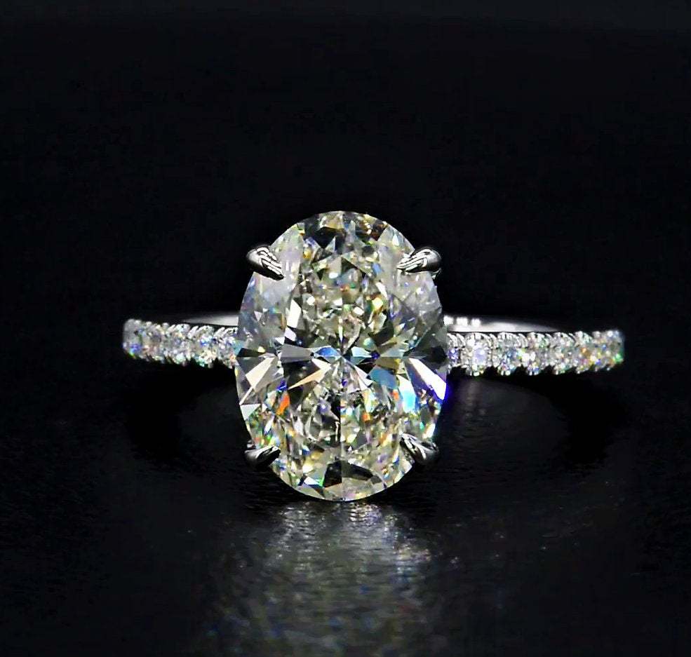 Oval Cut Simulated Diamond Hidden Halo Engagement And