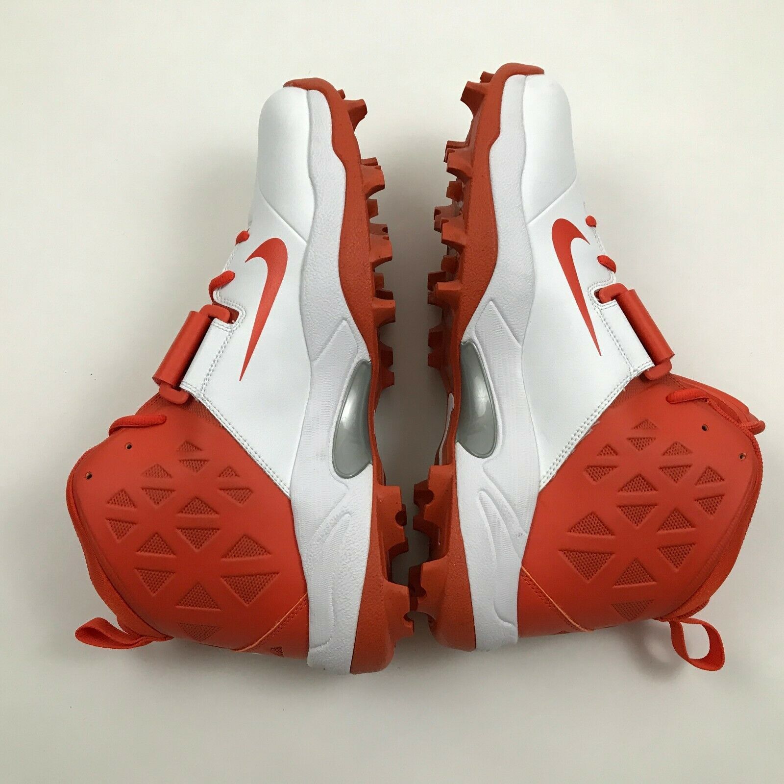 orange and white cleats