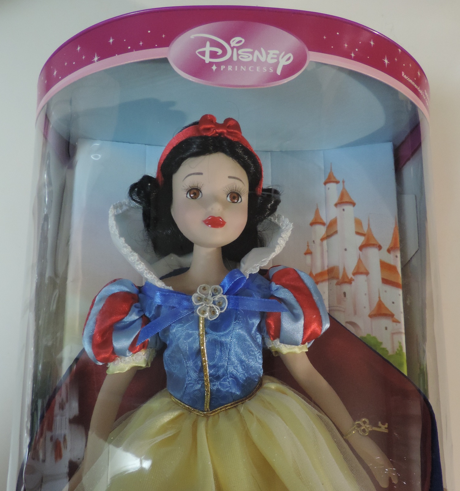 snow white porcelain doll brass key