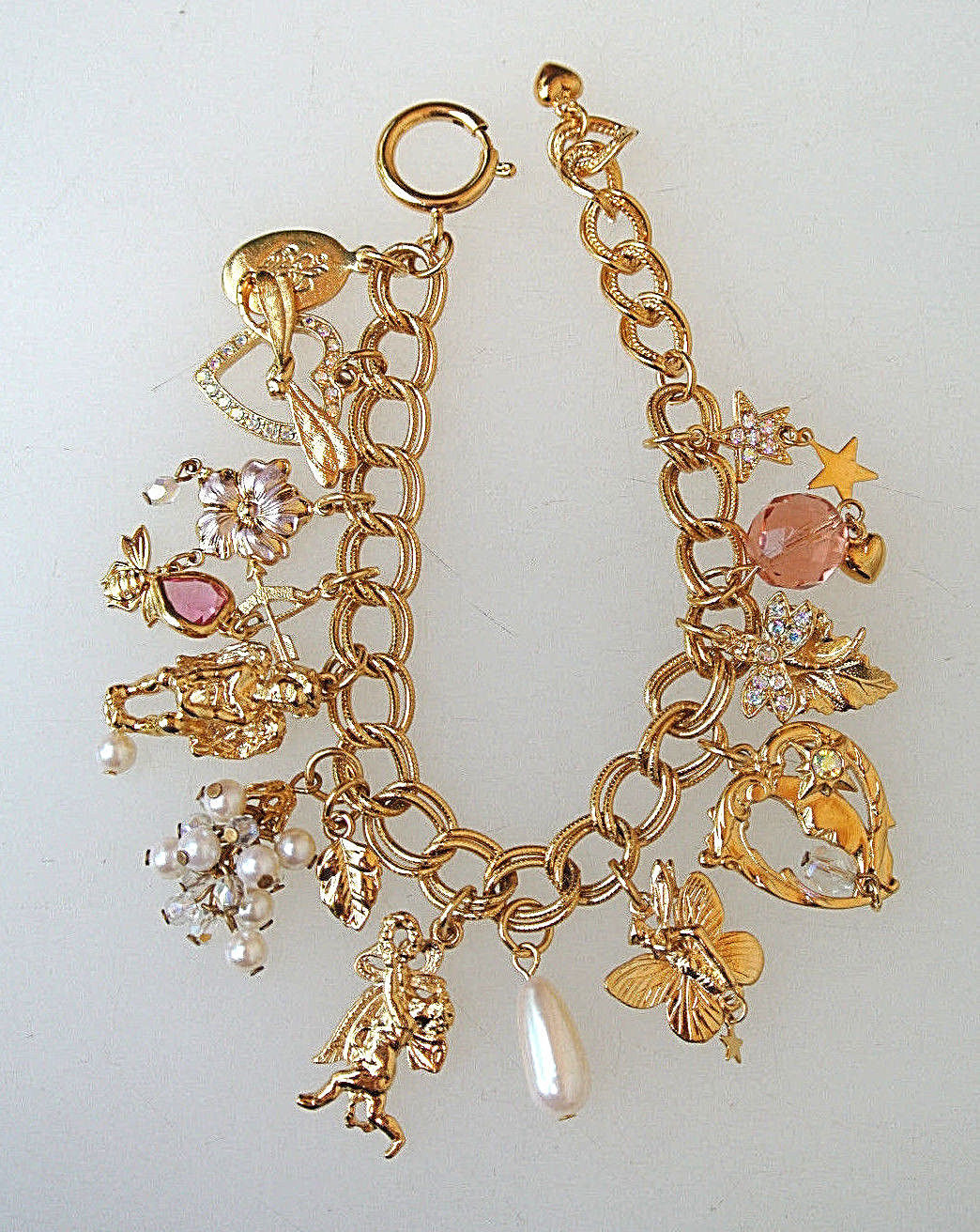Primary image for KIRKS FOLLY Gold-tone 13 Charms BRACELET 7 1/2" to 9"-hearts cherub angels stars
